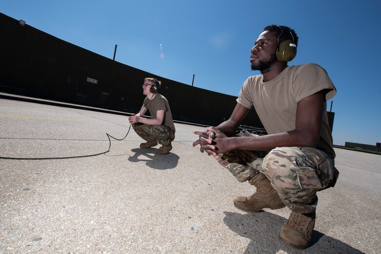 Airmen monitor F-16 refueling.