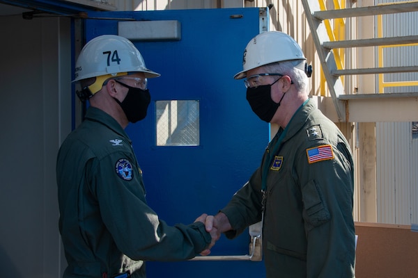 U.S. Navy Capt. Cassidy Norman, commanding officer of the aircraft carrier USS John C. Stennis (CVN 74), greets U.S. Navy Rear Adm. John Meier, Commander, Naval Air Force Atlantic, on the quarterdeck of the floating accommodation facility in Newport News, Virginia, May 14, 2021. The John C. Stennis is in Newport News Shipyard working alongside NNS, NAVSEA and contractors conducting RCOH. (U.S. Navy photo by Mass Communication Specialist 3rd Class Brennen Easter)