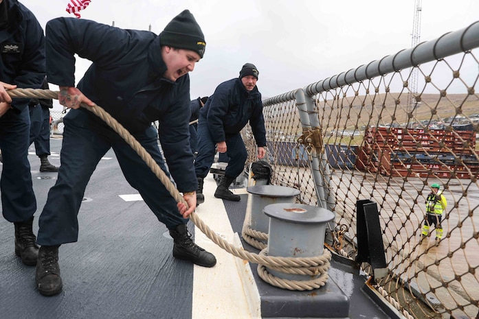 Sailors stationed aboard the Arleigh Burke-class guided-missile destroyer USS Ross (DDG 71) lower an accomodation ladder to the pier in port in the Faroe Islands, May 15, 2021.