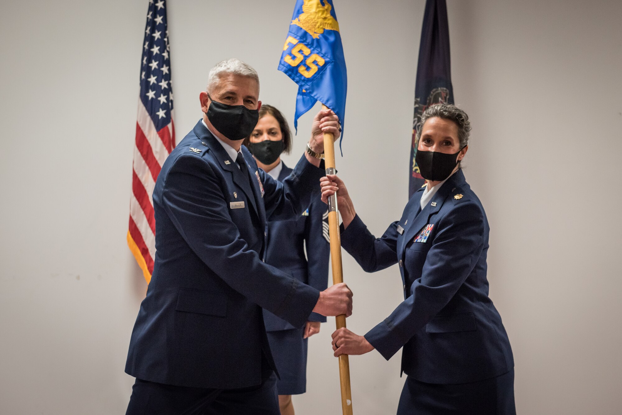 U.S. Air Force Maj. Anne Furman, right, accepts the 193rd Special Operations Force Support Squadron guidon from Col. Scott Harron, 193rd Special Operations Mission Support Group commander, Pennsylvania Air National Guard, during an assumption of command ceremony, May 15, 2021 at the 193rd Special Operations Wing in Middletown, Pennsylvania