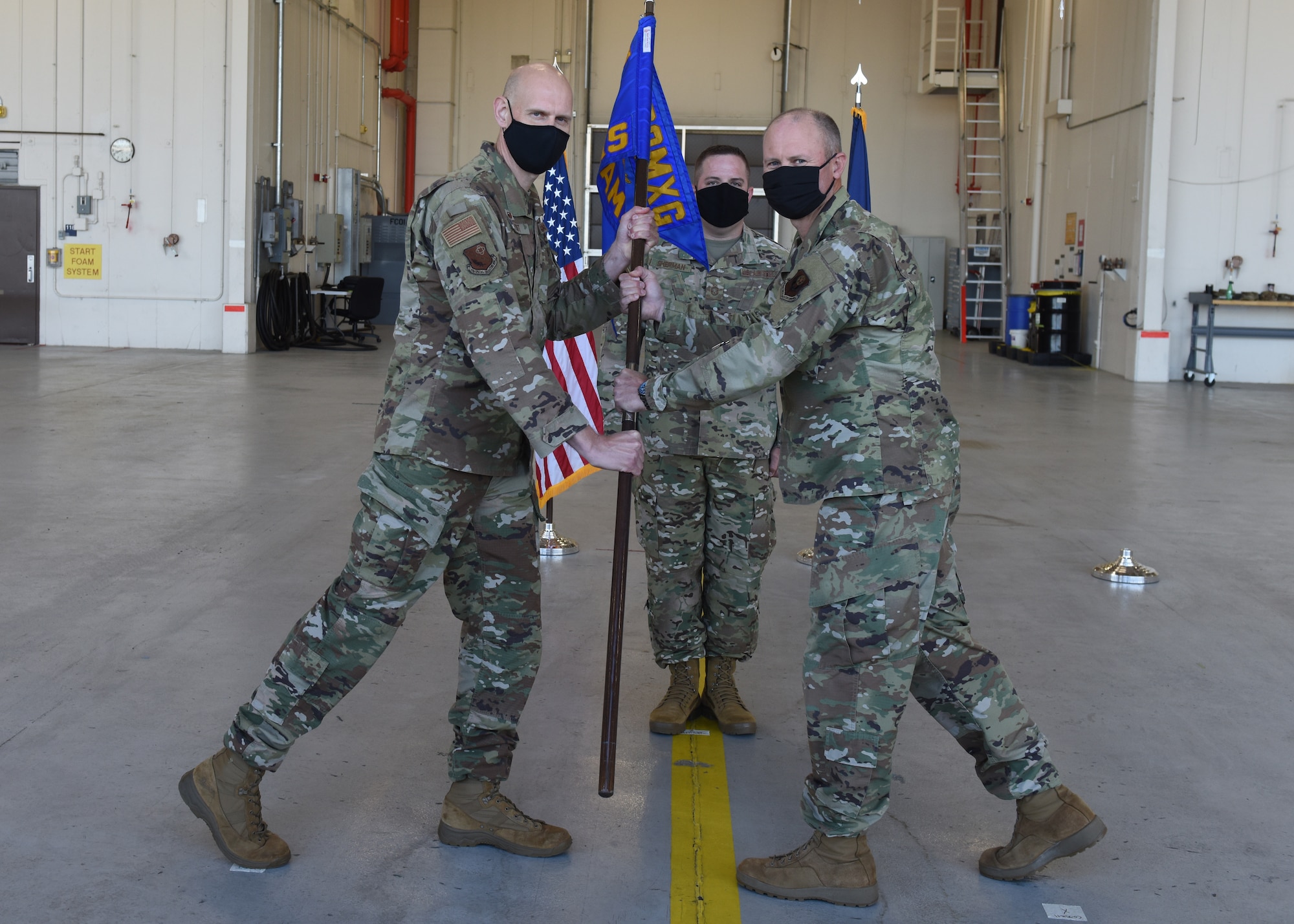 U.S. Air Force Lt. Col. Seth Cassell, right, accepts the 193rd Special Operations Aircraft Maintenance Squadron guidon from Col. Kristian Post, 193rd Special Operations Maintenance Group commander, Pennsylvania Air National Guard, during an assuption of command ceremony May 15, 2021, at the 193rd Special Operations Wing in Middletown, Pennsylvania. Cassell assumed command of the 193rd SOAMXS after serving in various positions within the 193rd Special Operations Group and SOMXG. (U.S. Air National Guard photo by Master Sgt. Matt Schwartz)