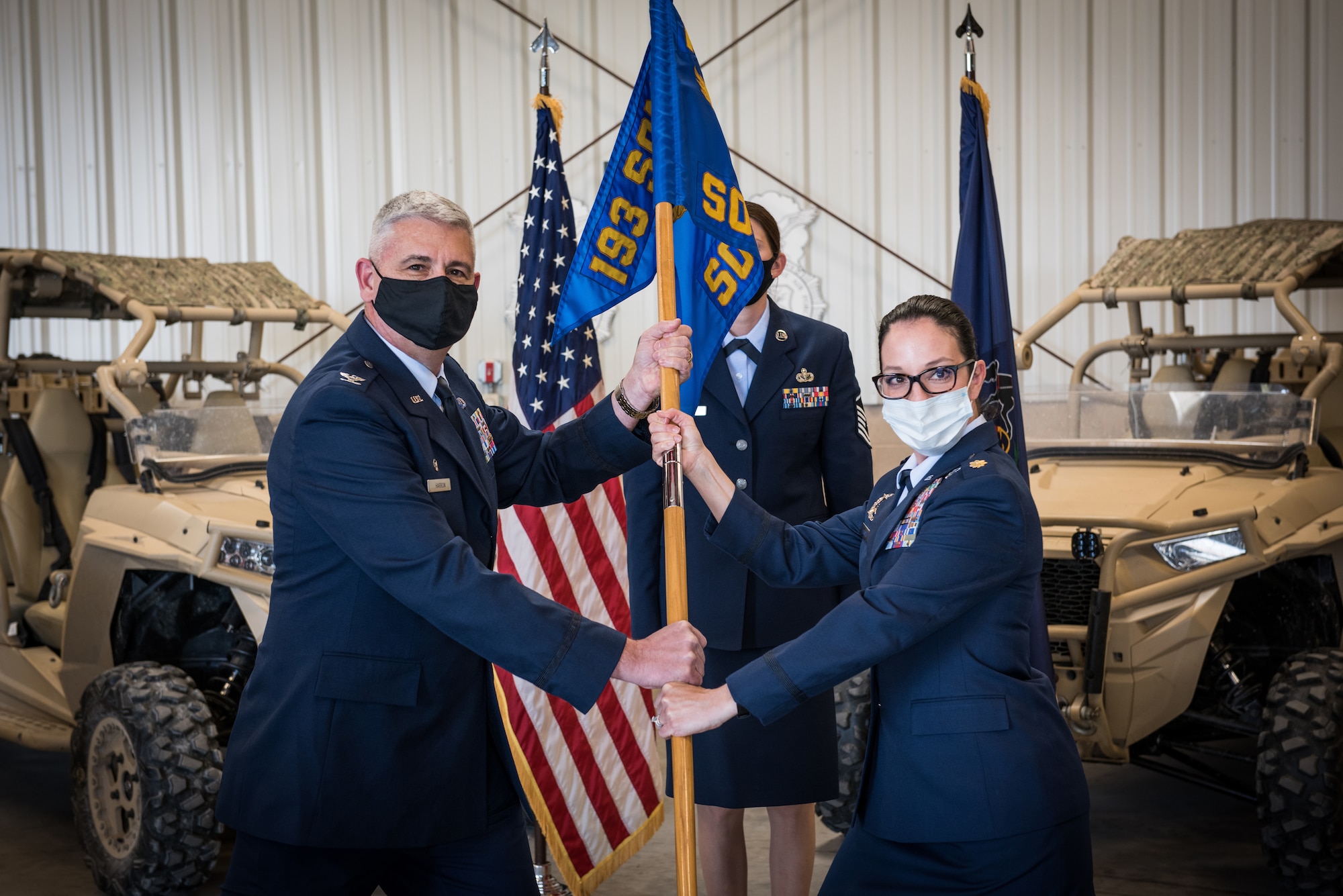 U.S. Air Force Maj. Kathleen Fabrizi, right, accepts the 193rd Special Operations Security Forces Squadron guidon from Col. Scott Harron, 193rd Special Operations Mission Support Group commander, Pennsylvania Air National Guard, during an assumption of command ceremony May 15, 2021, at the 193rd Special Operations Wing in Middletown, Pennsylvania. Fabrizi assumed command of the 193rd SOSFS after serving in various positions throughout the 193rd SOW. (U.S. Air National Guard photo by Staff Sgt. Tony Harp)