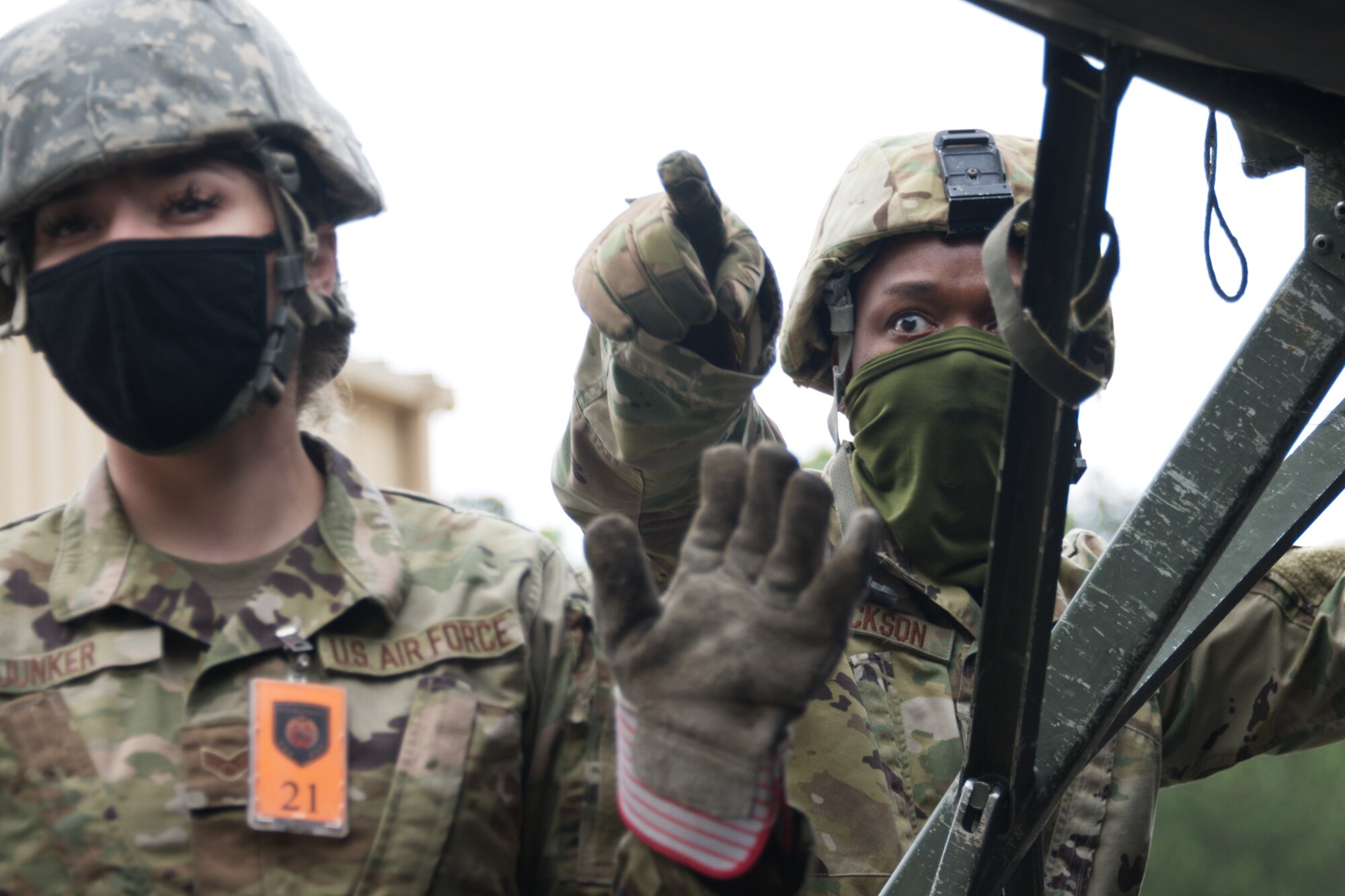 Photo of Airman pointing and gesturing.