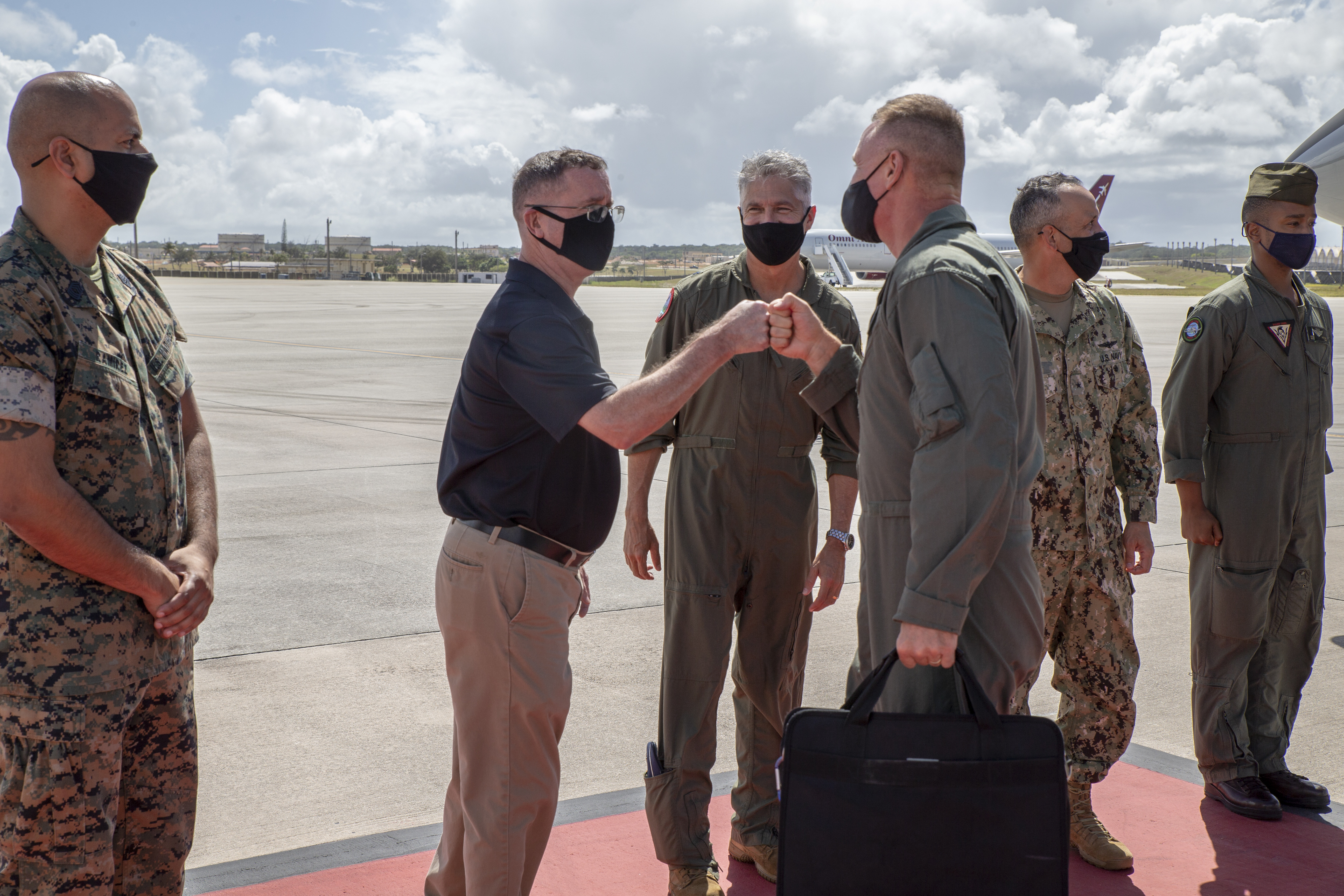 Donald Baldwin, the Marine Corps Base (MCB) Camp Blaz Chief of Staff, greets Lt. Gen. Steven Rudder, the Marine Forces Pacific Commanding General, at the Andersen Air Force Base terminal during a visit to MCB Camp Blaz, March 6, 2021.