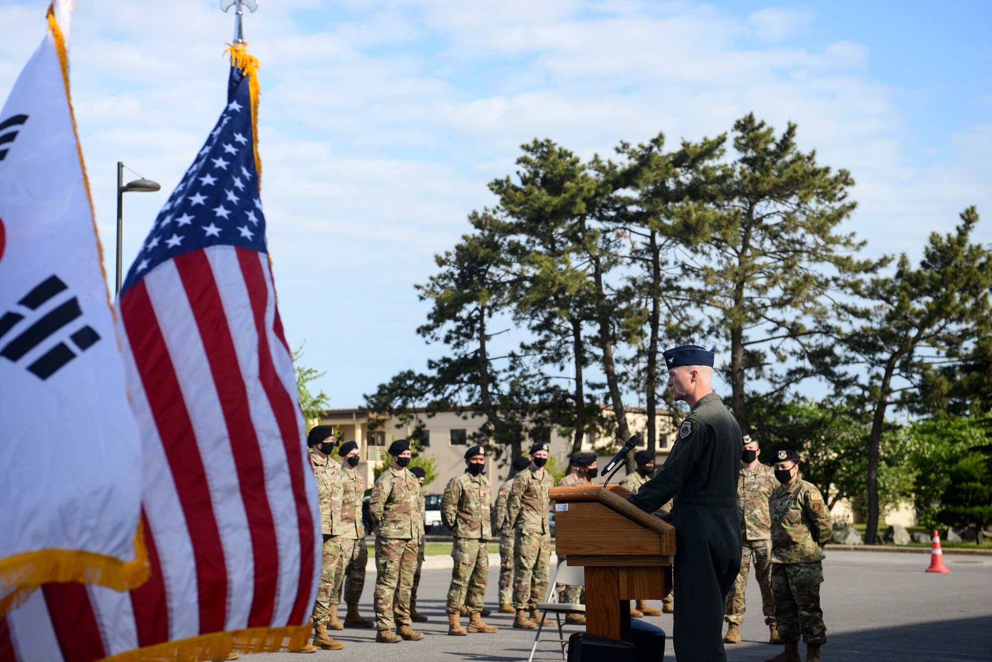 A commander speaks during a ceremony.