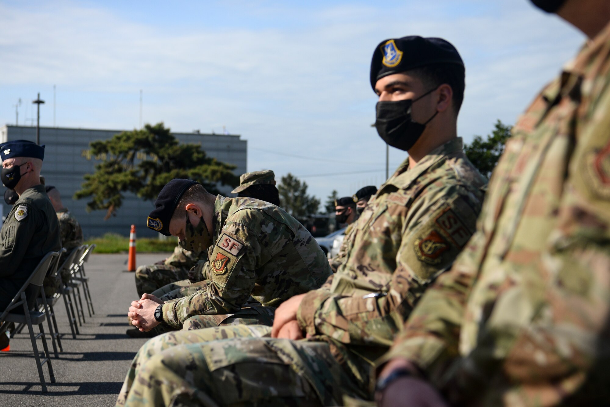 An Airman rests his head down during a Police Week ceremony.