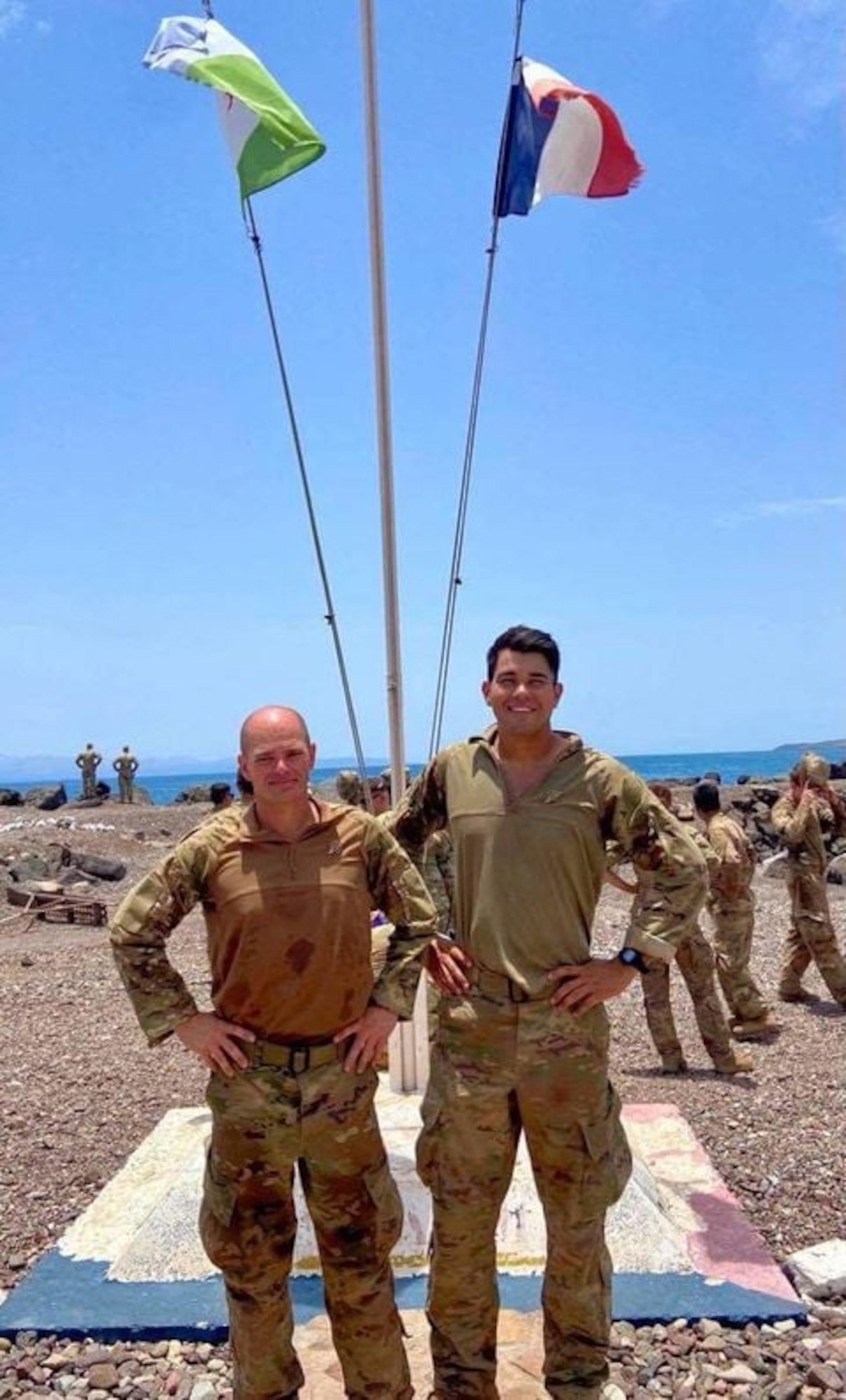 Technical Sergeant Jason Geyer (left) and Senior Airman Michael Lane, 776th Expeditionary Airbase Squadron, smile at the completion of the multi-day French Desert Commando Course. Out of more than 30 participants across the Djibouti Base Cluster and 25 finishers, they were the only two Air Force members to complete the course. This course exposes troops to desert survival, weapons training, desert combat, land navigation and obstacle courses.