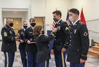 Col. Laura McHugh, deputy adjutant general-Army, Pennsylvania National Guard, presents Sgt. James McGill of the Maryland Army National Guard with an Army Commendation Medal at the conclusion of the Region II Best Warrior Competition May 14, 2021, at Fort Indiantown Gap. Eleven enlisted National Guard Soldiers from Pennsylvania, Maryland, Virginia, West Virginia, Washington D.C. and Delaware competed in the 2021 regional Best Warrior Competition at Fort Indiantown Gap May 11-14. Pfc. Alexander Gravely, a combat medic with 1st Battalion, 201st Field Artillery Regiment, 77th Brigade Troop Command, West Virginia Army National Guard, won the best Soldier portion of the competition. McGill, a radiology specialist with the 224th Medical Company Area Support, Maryland Army National Guard, won the best noncommissioned officer portion of the Best Warrior Competition.  (U.S. Army National Guard photo by Staff Sgt. Zane Craig)