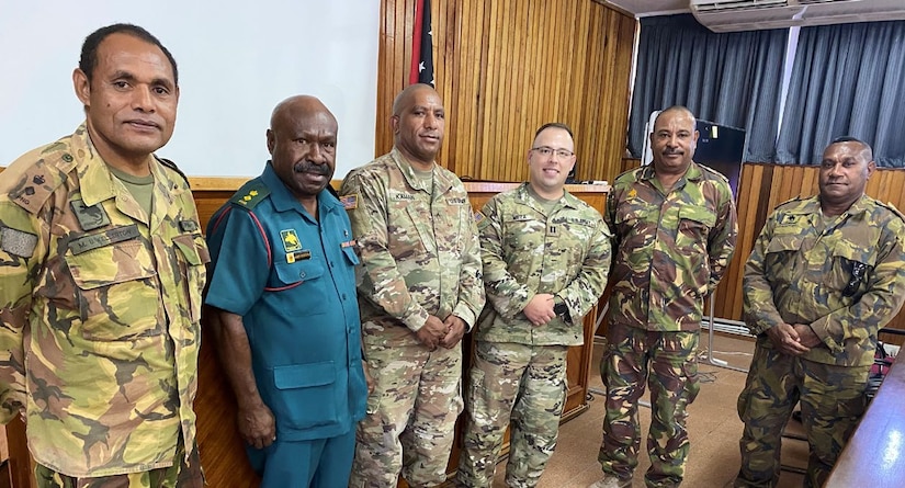 Capt. Christopher Meza, a Wisconsin Army National Guard officer, with senior leaders from the Papua New Guinea Defense Force. Meza spent nearly six months in Papua New Guinea where he represented the Wisconsin National Guard as part of its new State Partnership Program partnership with Papua New Guinea.