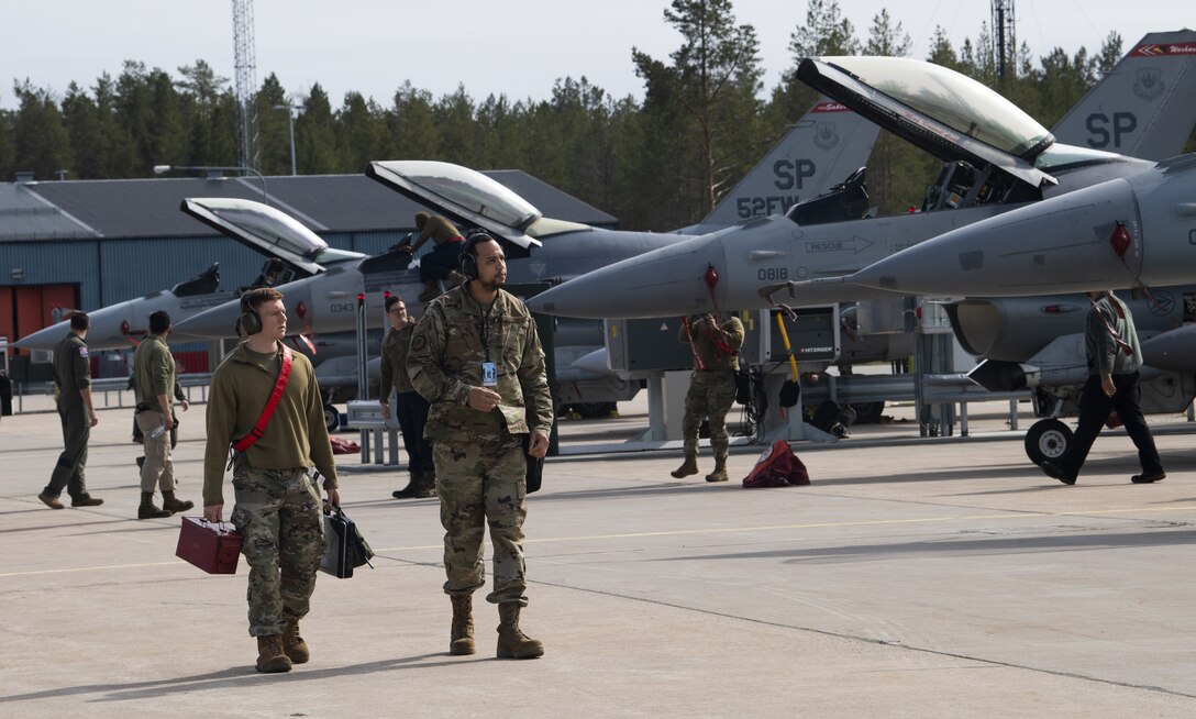 U.S. Air Force F-16 Fighting Falcon aircraft and Airmen assigned to the 52nd Fighter Wing at Spangdahlem Air Base, Germany, arrive at Kallax Air Base, Sweden, May 17, 2021. The aircraft will support the Arctic Challenge Exercise 21, during which the U.S., allies and partner nations will exercise the ability to plan, execute and evaluate Large Force Employments in a multinational air operation. (U.S. Air Force photo by Senior Airman Ali Stewart)