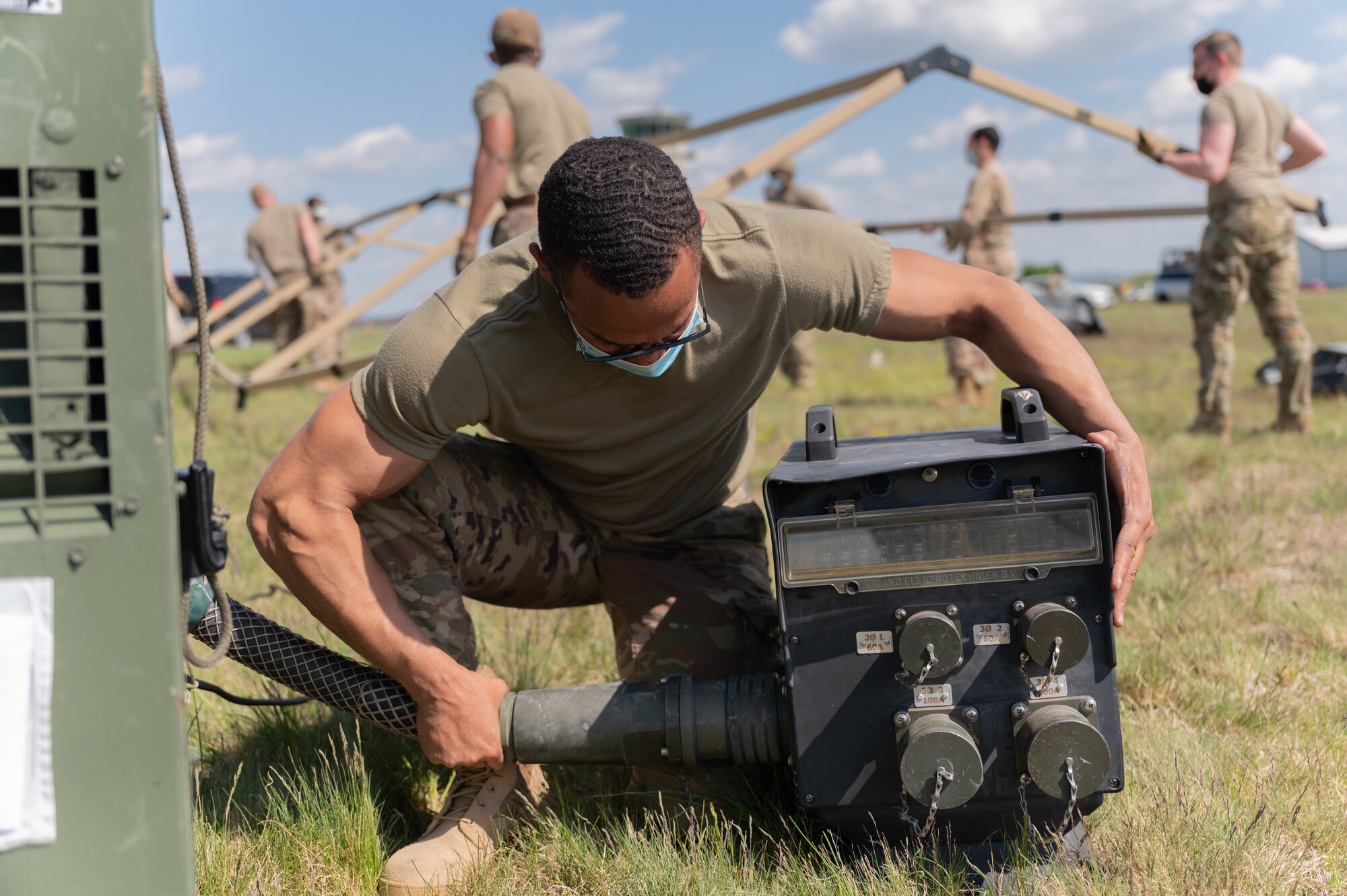 Airman connecting a generator.
