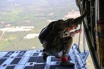 U.S. Army Reserve Maj. Mark Montgomery, jumpmaster and officer in charge of the U.S. Army Civil Affairs and Psychological Operations Command (Airborne) G37, checks for ground hazards upon approach to Sicily Drop Zone, Ft. Bragg, N.C., May 1, 2021. Montgomery was a designated safety for the unit’s jump from the tail ramp of a U.S. Marine KC-130 aircraft.