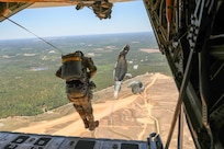 Soldiers from Headquarters and Headquarters Company, U.S. Army Civil Affairs and Psychological Operations Command (Airborne) perform nontactical airborne operations utilizing T-10C parachutes and their own skills and training as they exit a U.S. Marine KC-130 during a static line jump over Sicily Drop Zone, Ft. Bragg, N.C., May 1, 2021. The tail ramp jump allowed Soldiers the opportunity to refresh their skills and update their jump qualifications.