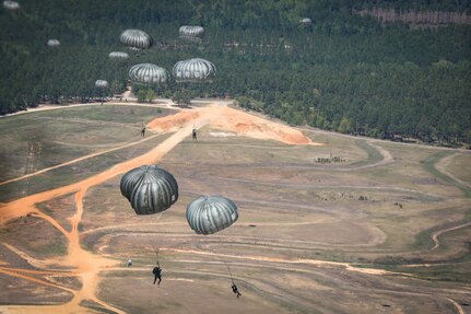 Soldiers from Headquarters and Headquarters Company, U.S. Army Civil Affairs and Psychological Operations Command (Airborne) took to the skies to participate in a tail ramp jump from a U.S. Marine KC-130 aircraft onto Sicily Drop Zone, Ft. Bragg, N.C., on May 1, 2021.  After a year of COVID-19 restrictions and virtual battle assemblies, the jump provided an opportunity for Soldiers to refine their skills and refresh their qualifications.