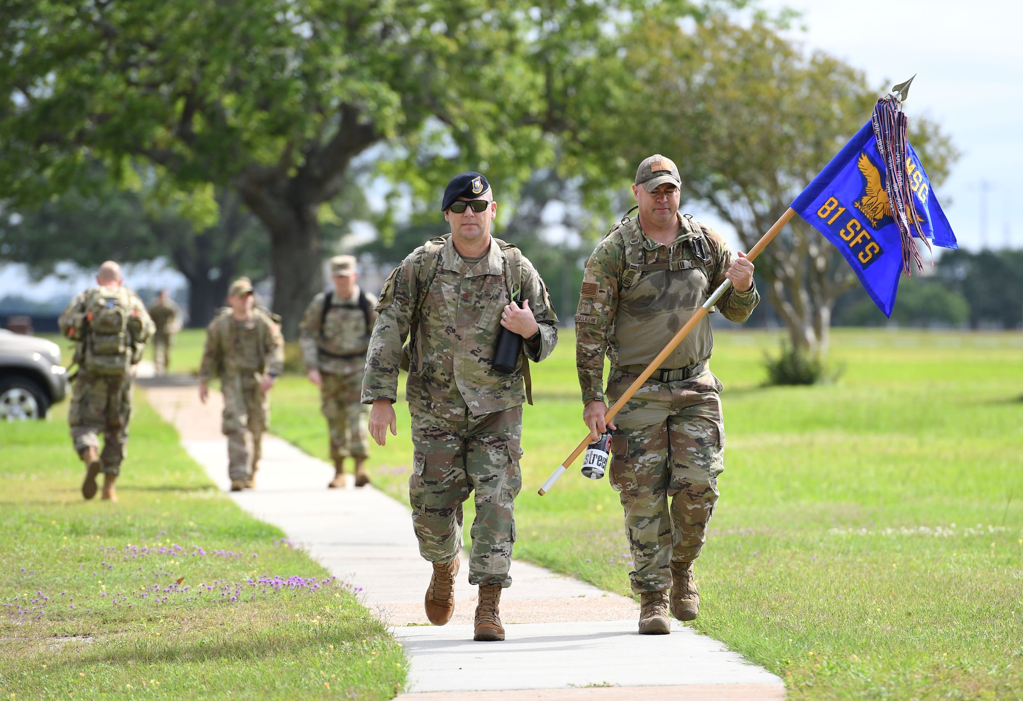 Members of the 81st Security Forces Squadron participate in an 81st SFS Ruck March/Canned Food Drive at Keesler Air Force Base, Mississippi, May 13, 2021. The event was held during National Police Week, which recognizes the men and women in law enforcement. (U.S. Air Force photo by Kemberly Groue)
