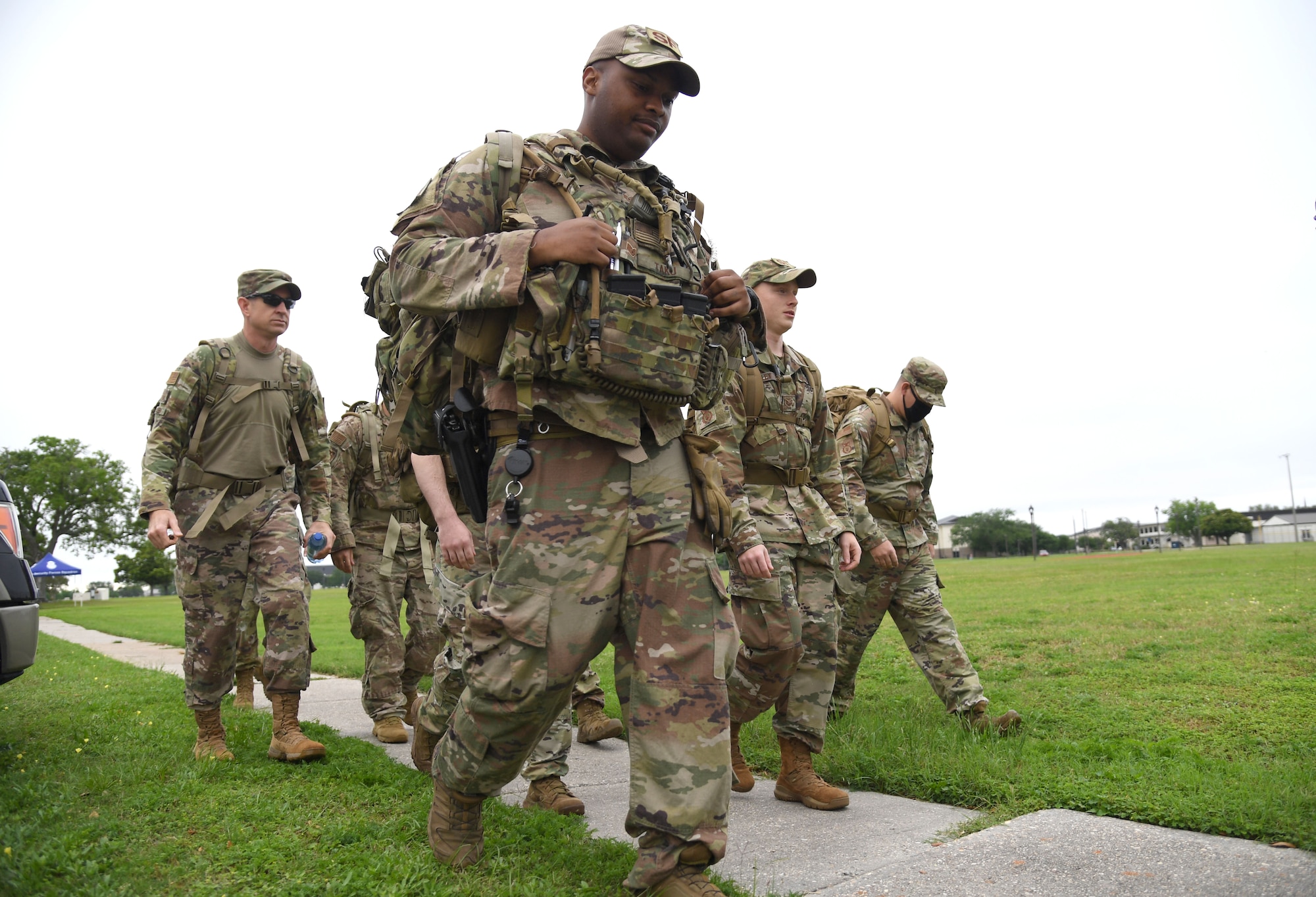 Members of the 81st Security Forces Squadron participate in an 81st SFS Ruck March/Canned Food Drive at Keesler Air Force Base, Mississippi, May 13, 2021. The event was held during National Police Week, which recognizes the men and women in law enforcement. (U.S. Air Force photo by Kemberly Groue)