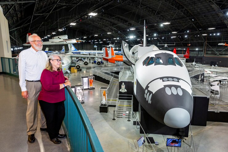 Couple looking over the balcony of Building 4