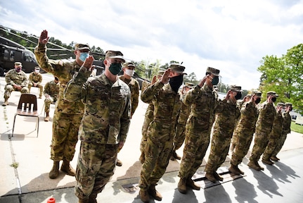 The Virginia National Guard’s 2nd Battalion, 224th Aviation Regiment welcomes newly-promoted noncommissioned officers to the NCO Corps during a ceremony held April 18, 2021, at the VNG’s Army Aviation Support Facility in Sandston, Virginia. A total of 16 NCOs, all promoted to sergeant since 2019, were recognized during the ceremony in front of state and unit enlisted leaders and members of their battalion. (U.S. Army National Guard photo by Sgt. 1st Class Terra C. Gatti)