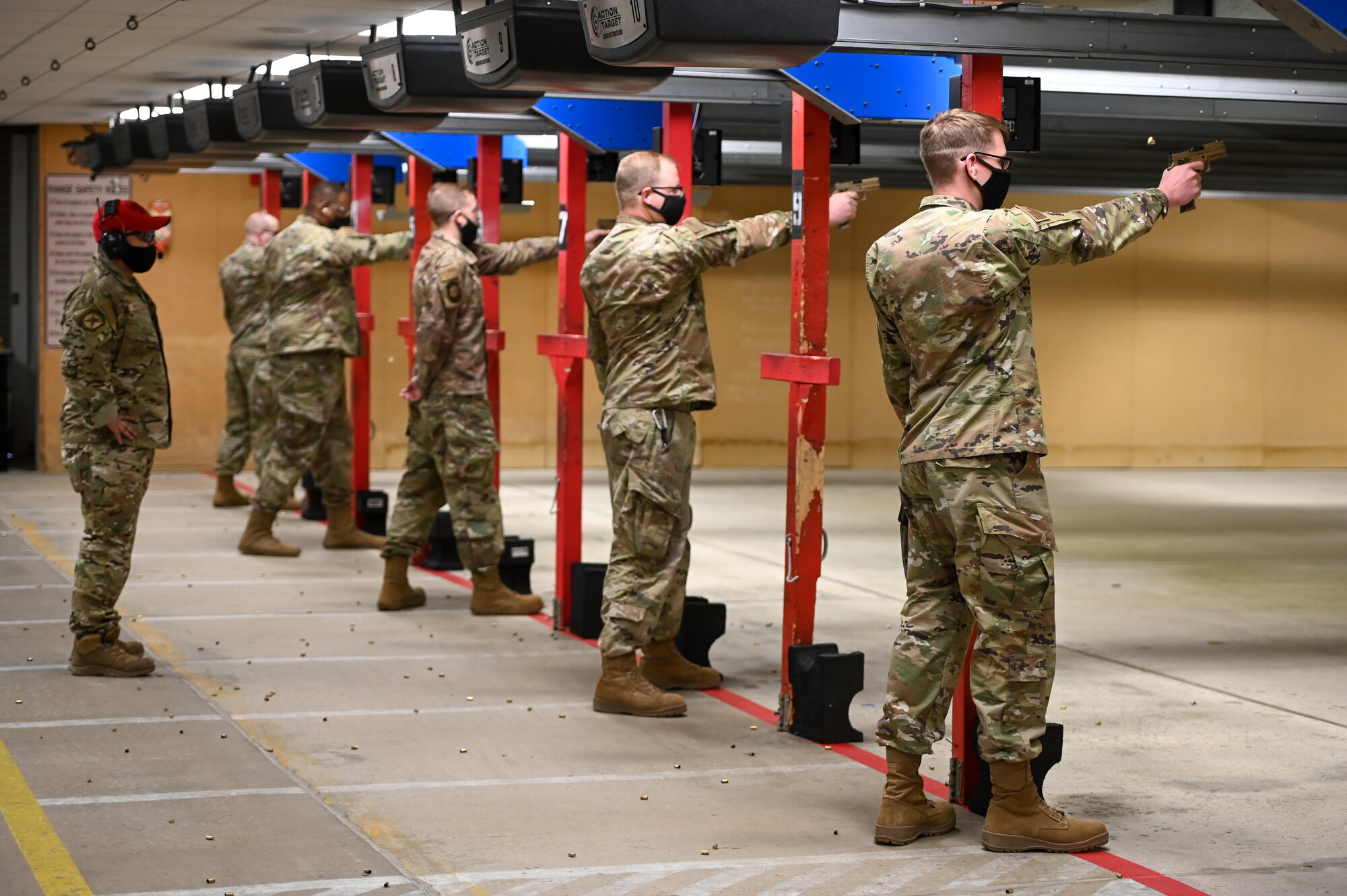 Airmen participate in the National Police Week pistol shooting competition May 13, 2021, at Hill Air Force Base, Utah. The competition included one-handed shooting and was one of many events 75th Security Forces Squadron hosted to commemorate the week to honor the sacrifices of the law enforcement community. (U.S. Air Force photo by Cynthia Griggs)