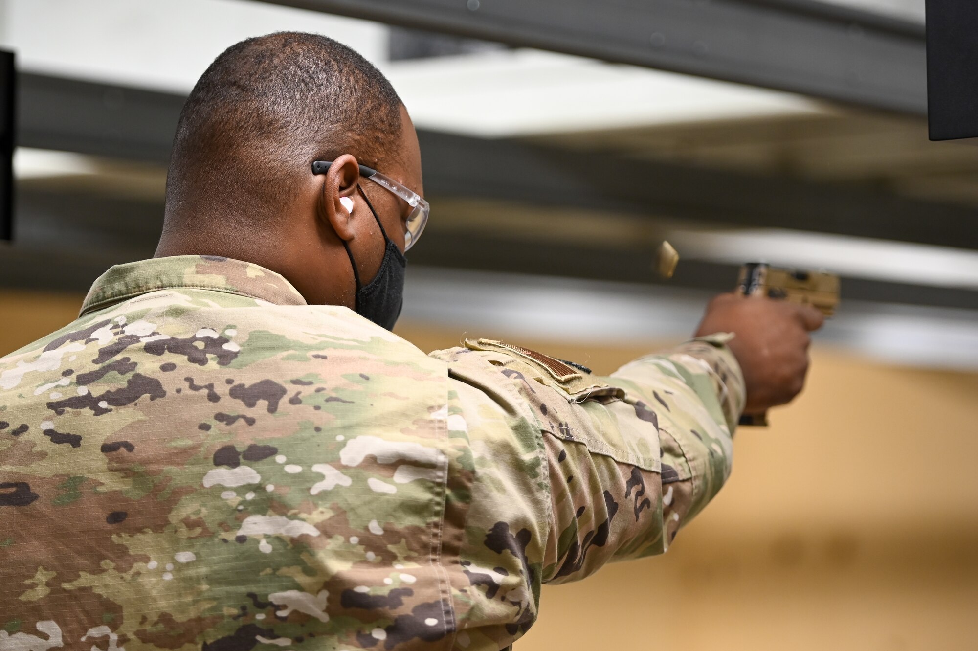 Tech. Sgt. Kandall Emile, 75th Security Forces Squadron, participates in the National Police Week pistol shooting competition May 13, 2021, at Hill Air Force Base, Utah. The competition included one-handed shooting and was one of many events 75th Security Forces Squadron hosted to commemorate the week to honor the sacrifices of the law enforcement community. (U.S. Air Force photo by Cynthia Griggs)