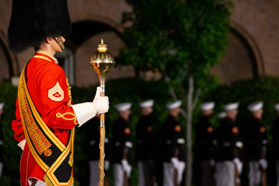 Gunnery Sgt. Monica Preston, assistant drum major, “The Presidents Own,” U.S. Marine Band, leads the band during “pass in review” at Marine Barracks Washington, D.C., May 14, 2021.  The Deputy Commandant for Combat Development and Integration and Commanding General of Marine Corps Combat Development Command Lt. Gen. Eric M. Smith, was the hosting official, and the guests of honor were the 12th NASA Administrator the Honorable Charles F. Bolden, Jr., Maj. Gen., USMC (Ret.); NASA Astronaut and active duty Marine Lt. Col. Nicole A. Man; and NASA Astronaut and active duty Marine Maj. Jasmin Moghbeli.  (U.S. Marine Corps photo by Lance Cpl. Allen Sanders)