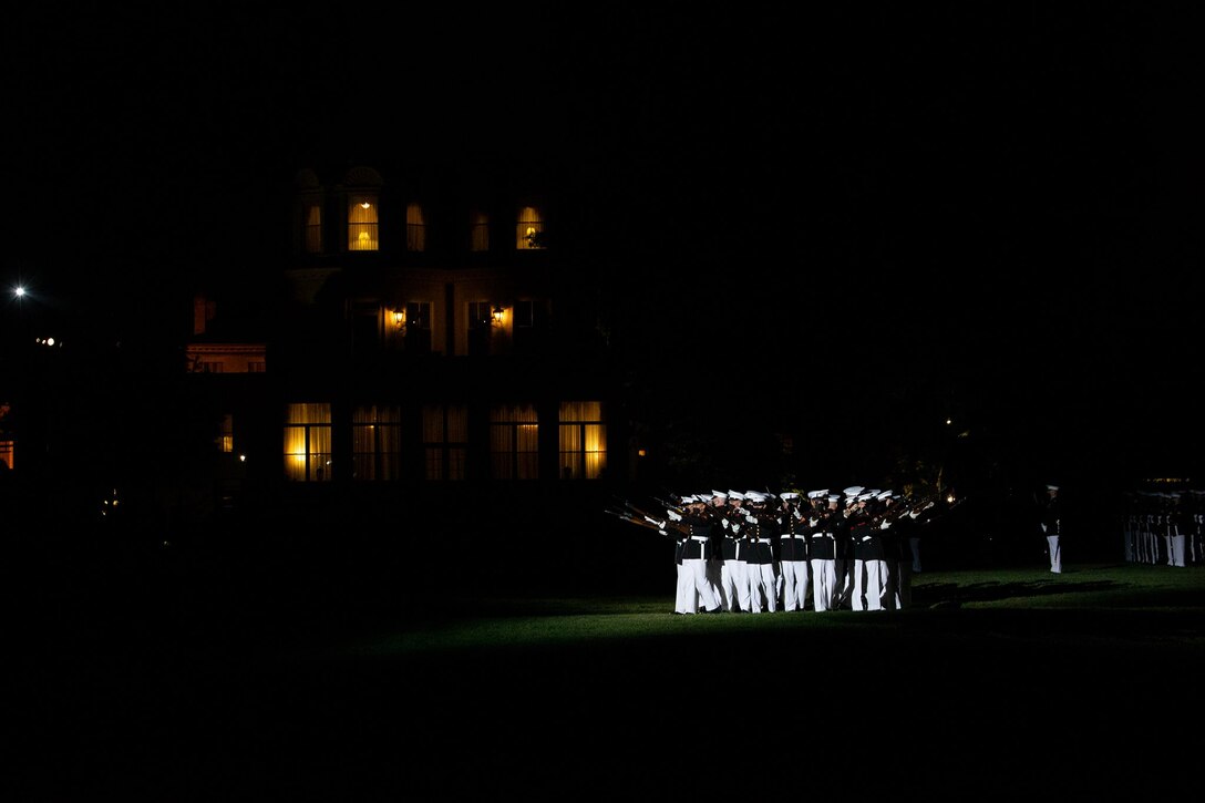 Marines with the Silent Drill Platoon conduct their “bursting bomb” sequence during a Friday Evening Parade at Marine Barracks Washington, D.C., May 14, 2021. The Deputy Commandant for Combat Development and Integration and Commanding General of Marine Corps Combat Development Command Lt. Gen. Eric M. Smith, was the hosting official, and the guests of honor were the 12th NASA Administrator the Honorable Charles F. Bolden, Jr., Maj. Gen., USMC (Ret.); NASA Astronaut and active duty Marine Lt. Col. Nicole A. Man; and NASA Astronaut and active duty Marine Maj. Jasmin Moghbeli.  (U.S. Marine Corps photo by Lance Cpl. Allen Sanders)