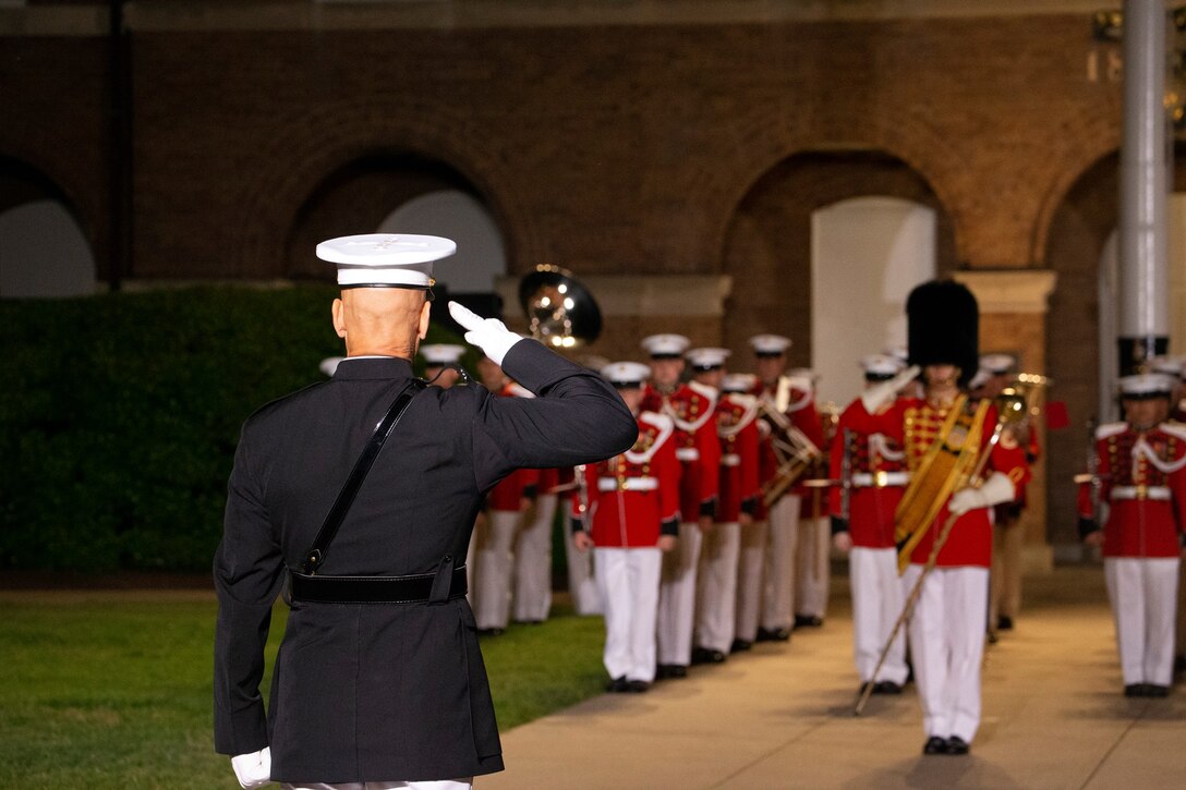 Lieutenant Col. Darrel L. Choat, executive officer, Marine Barracks Washington, renders a salute during the Friday Evening Parade at Marine Barracks Washington, D.C., May 14, 2021. The Deputy Commandant for Combat Development and Integration and Commanding General of Marine Corps Combat Development Command Lt. Gen. Eric M. Smith, was the hosting official, and the guests of honor were the 12th NASA Administrator the Honorable Charles F. Bolden, Jr., Maj. Gen., USMC (Ret.); NASA Astronaut and active duty Marine Lt. Col. Nicole A. Man; and NASA Astronaut and active duty Marine Maj. Jasmin Moghbeli.  (U.S. Marine Corps photo by Lance Cpl. Allen Sanders)