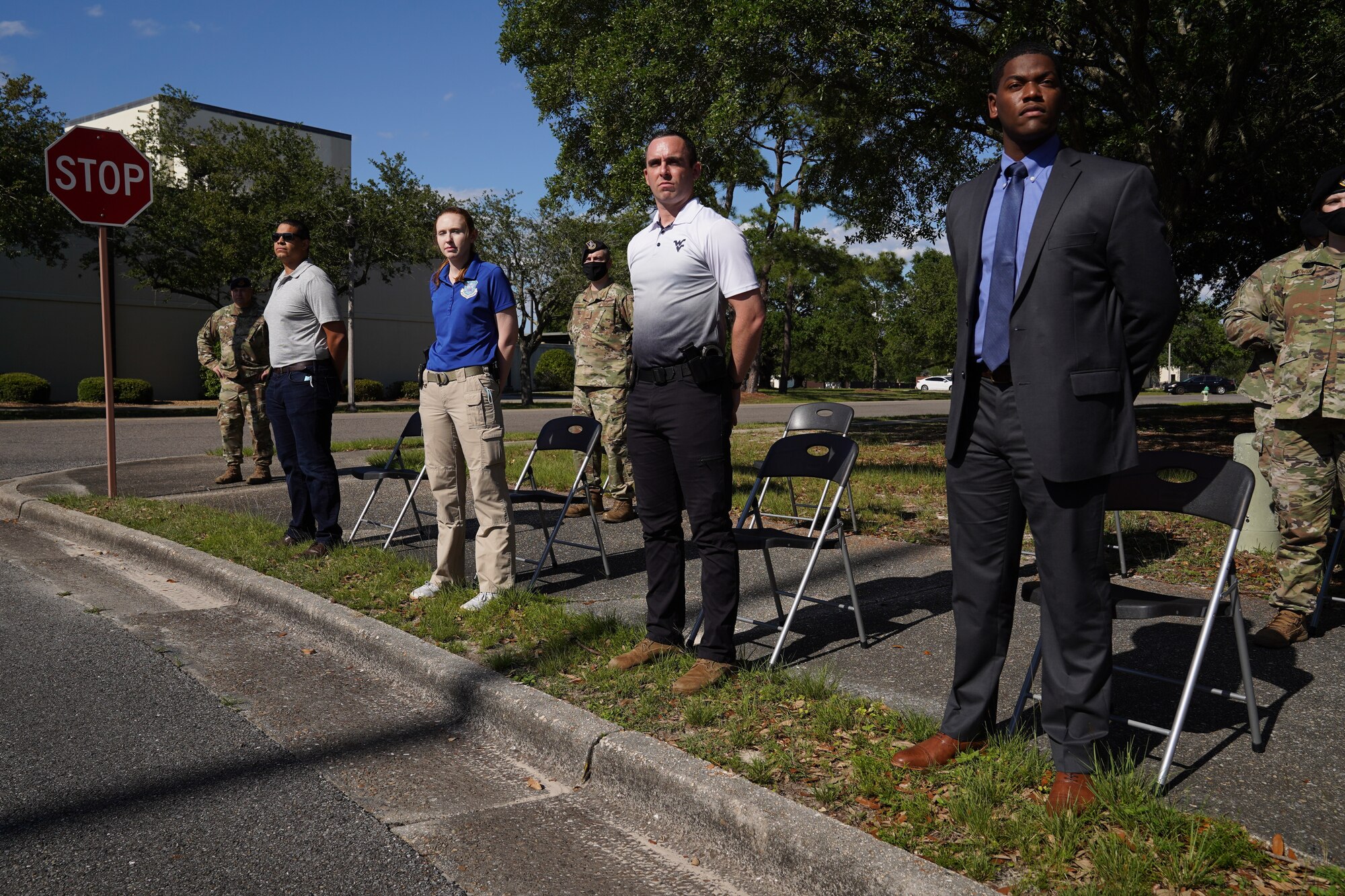 Members from the Air Force Office of Special Investigations Detachment 407 stand during the Police Week retreat ceremony at Keesler Air Force Base, Mississippi, May 14, 2021. The event was held during National Police Week, recognizing the men and women in law enforcement. (U.S. Air Force photo by Senior Airman Spencer Tobler)