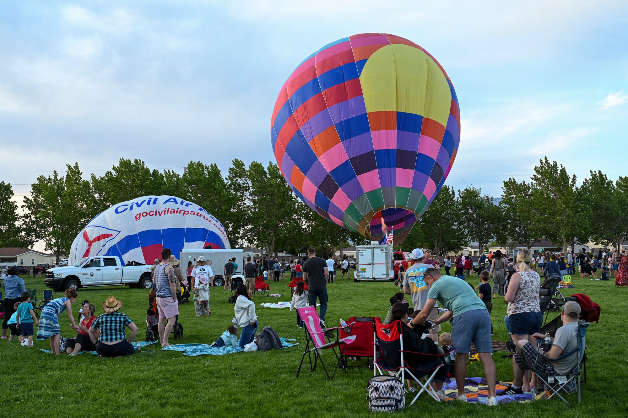 People gather to watch balloons