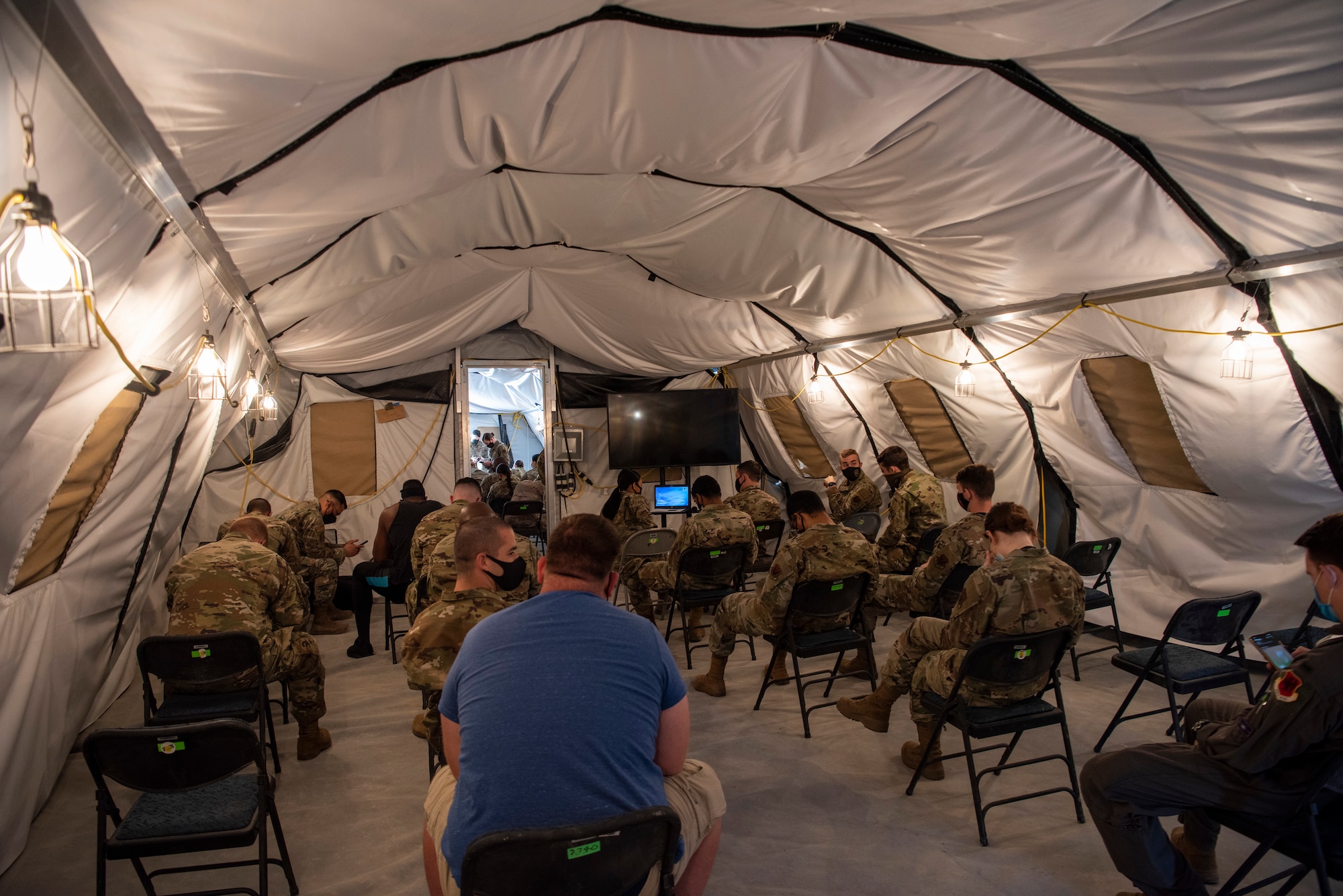 Airmen from the 432nd Wing/432nd Air Expeditionary Wing attend a COVID-19 vaccination briefing before receiving the vaccine at Creech Air Force Base.