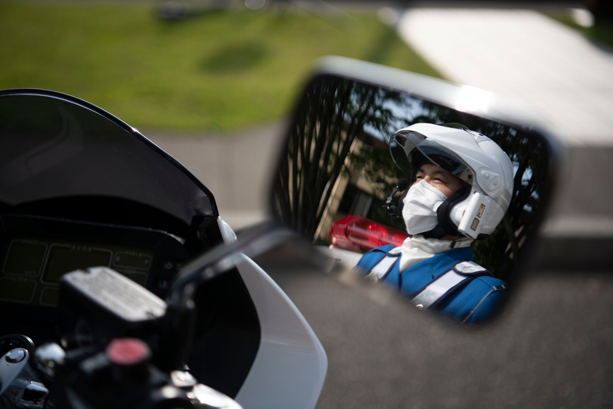 A Japanese police officer watches the Police Week retreat ceremony for National Police Week at Yokota Air Base, Japan, May 14, 2021. Police Week featured several events to honor police officers and security forces members who were killed or injured in the line of duty. (U.S. Air Force photo by Staff Sgt. Braden Anderson)