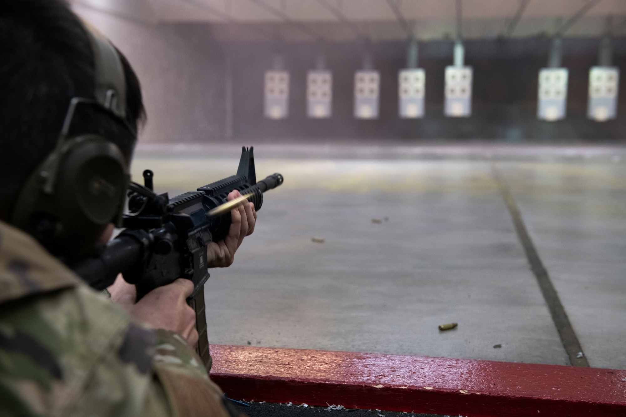 Staff Sgt. Dustin Webb, 374th Aircraft Maintenance Squadron Engines Aerospace Propulsion craftsman, fires an M4 carbine during National Police Week at Yokota Air Base, Japan, May 12, 2021. Webb fired his weapon and made adjustments, before competing in four timed rounds of the shoot off. (U.S. Air Force photo by Staff Sgt. Joshua Edwards)