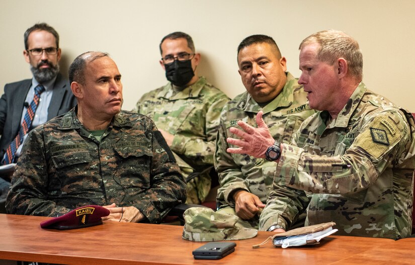 Maj. Gen. Kendall Penn, right, the Arkansas National Guard adjutant general, speaks with Maj. Gen Walfre Omar Carranza España, the Guatemalan chief of defense, during a May 13, 2021, briefing in North Little Rock about the Arkansas National Guard’s role in statewide emergencies. Arkansas and Guatemala, paired together since 2002 in the National Guard Bureau’s State Partnership Program, have a rich history of military and cultural exchanges.