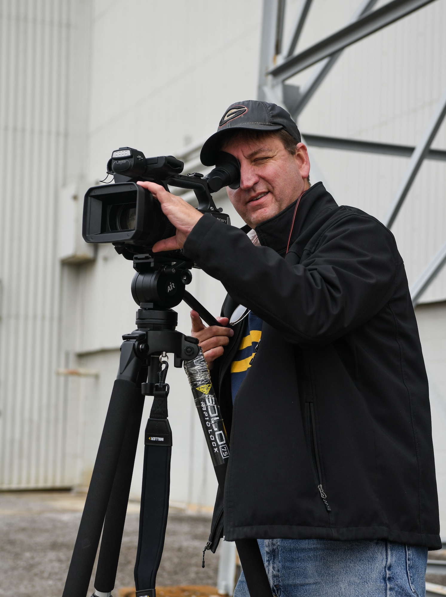 David Wright, a videographer for Arnold Engineering Development Complex, lines up a shot as he prepares to record video in support of the AEDC test mission, Dec. 14, 2020, at Arnold Air Force Base, Tenn. When not putting his video and editing skills to use at Arnold, Wright spends his free time on other creative projects, such as writing fantasy fiction novels. (U.S. Air Force photo by Jill Pickett)
