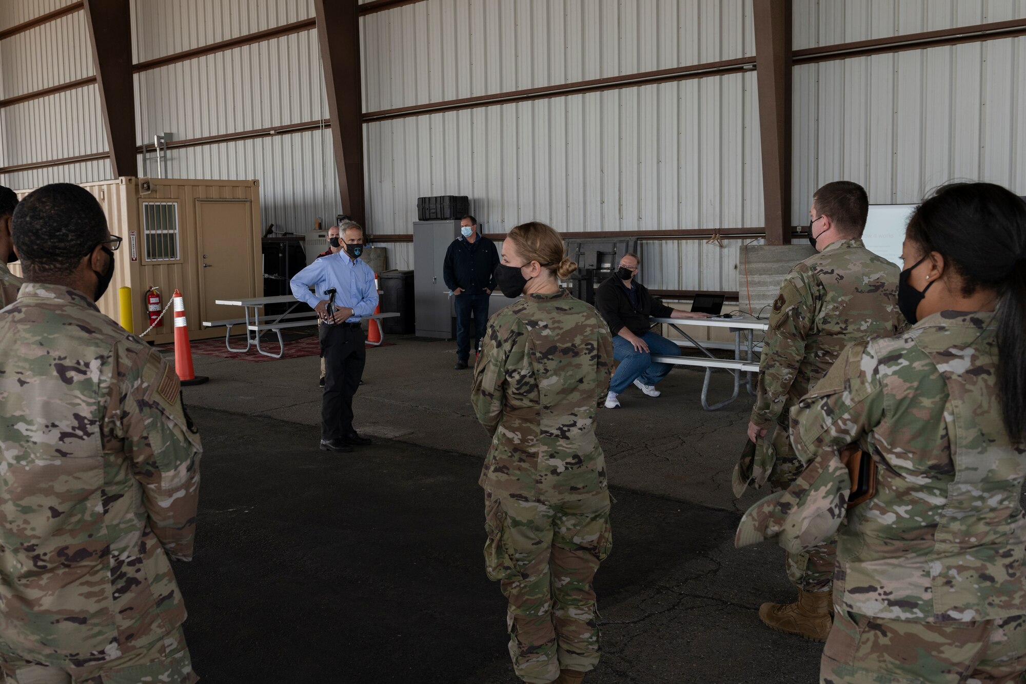 Dr. Thomas Sugar, Arizona State University professor, explains what an Aerial Porter Exoskeleton is to Team Travis Airmen May 14, 2021, at Travis Air Force Base, California. The Aerial Porter Exoskeleton is a piece of equipment designed to reduce strain when lifting various items. (U.S. Air Force photo by Senior Airman Cameron Otte)