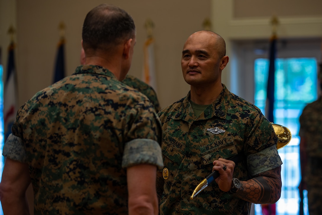 U.S. Navy Master Chief Petty Officer Christopher Rebana, right, is relieved of his charge as 2d Marine Division Command Master Chief by Maj. Gen. Frank Donovan, the Commanding General, on Camp Lejeune, N.C., May 17, 2021.