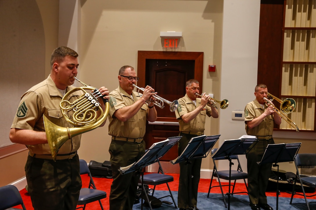 Marines with “The President’s Own,” U.S. Marine Band perform the Marines’ Hymn during the Color Sergeant of the Marine Corps relief and appointment ceremony at Marine Barracks Washington, D.C., May 17, 2021. The Color Sergeant of the Marine Corps serves as the senior sergeant of the Corps, entrusted with carrying the National Ensign in ceremonies throughout the National Capital Region and across the nation. The Color Sergeant leads the official Color Guard Platoon at MBW at is responsible for training and preparing the Marines for future service in the operating forces. (U.S. Marine Corps photo by Lance Cpl. Allen Sanders)