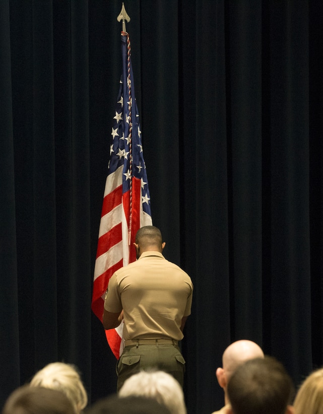 Sergeant Cameron Williams, 40th Color Sergeant of the Marine Corps, returns the National Ensign after receiving the title of newest Color Sergeant of the Marine Corps during a relief and appointment ceremony at Marine Barracks Washington, D.C., May 17, 2021.