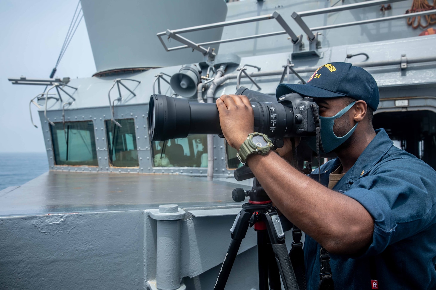 TAIWAN STRAIT (May 18, 2021) – Intelligence Specialist Chief Michael Tolbert, from Moss Point, Miss., stands watch on the bridge while the Arleigh Burke-class guided-missile destroyer USS Curtis Wilbur (DDG 54) conducts routine operations. Curtis Wilbur is assigned to Commander, Task Force 71/Destroyer Squadron (DESRON) 15, the Navy’s largest forward DESRON and the U.S. 7th Fleet’s principal surface force. (U.S. Navy photo by Mass Communication Specialist 3rd Class Zenaida Roth)