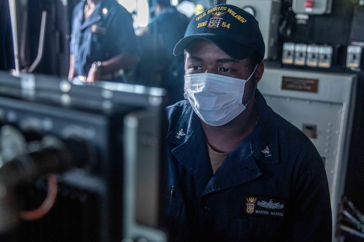 TAIWAN STRAIT (May 18, 2021) – Gunner’s Mate 2nd Class Marvin Harris, from Chicago, stands watch on the bridge of the Arleigh Burke-class guided-missile destroyer USS Curtis Wilbur (DDG 54) as the ship conducts routine operations. Curtis Wilbur is assigned to Commander, Task Force 71/Destroyer Squadron (DESRON) 15, the Navy’s largest forward DESRON and the U.S. 7th Fleet’s principal surface force. (U.S. Navy photo by Mass Communication Specialist 3rd Class Zenaida Roth)