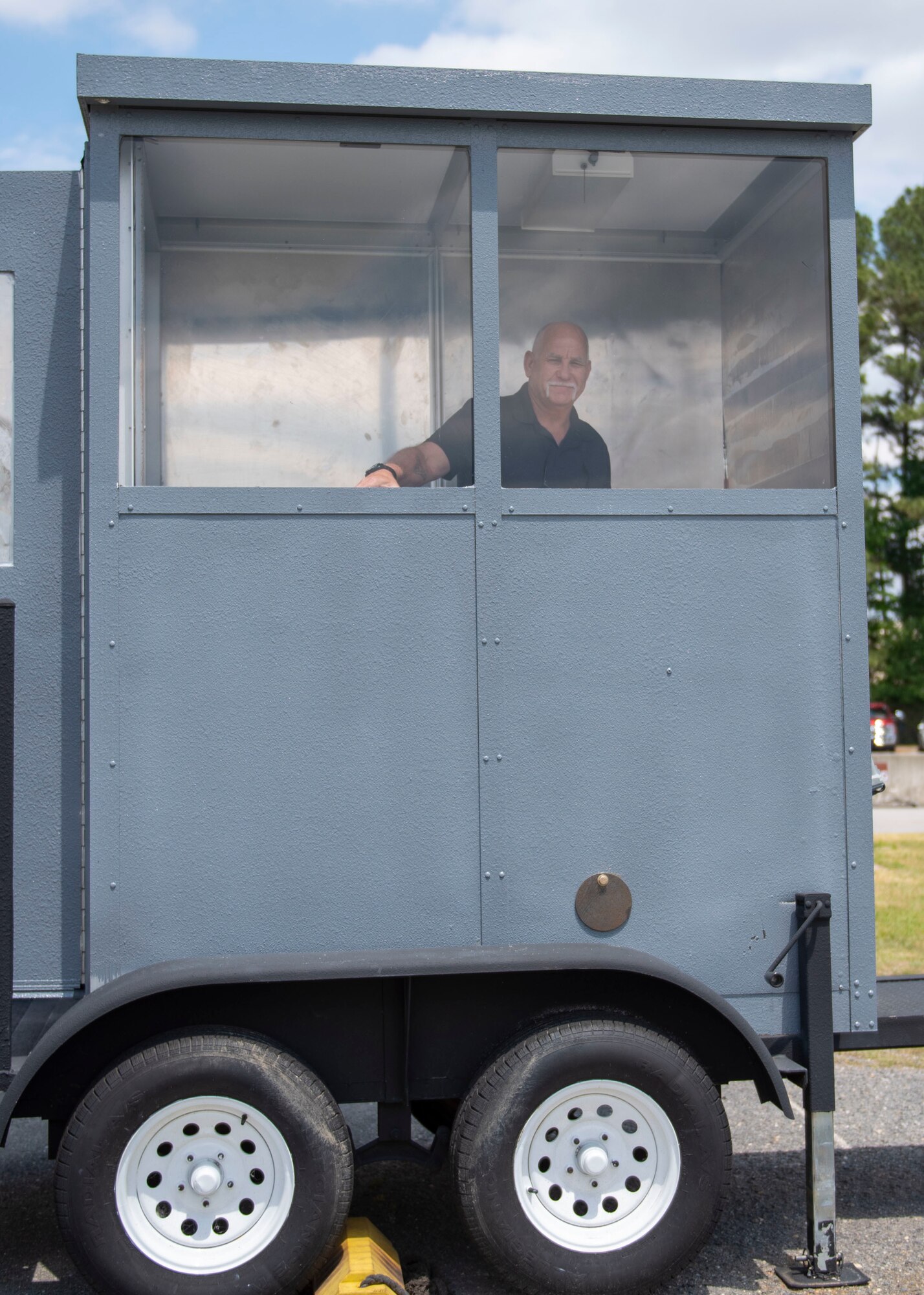 Mike Wise, Air Force Engineering and Technical Services propulsion specialist and crew chief, showcases the guard shack he repurposed at Seymour Johnson Air Force Base, North Carolina, May 6, 2021.