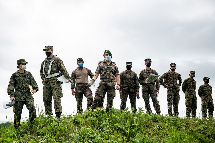 Japanese soldiers with Amphibious Rapid Deployment Brigade, Japan Self Defense Force, French Legionnaires and U.S. Marines with III Marine Expeditionary Force, oversee an amphibious landing rehearsal during exercise Jeanne D’Arc 21 at Camp Ainoura, Sasebo, Japan, May 13, 2021. ARC-21 is an opportunity for U.S., French, Japanese and Australian forces to share experiences, tactics, and best practices to sharpen their skills together.