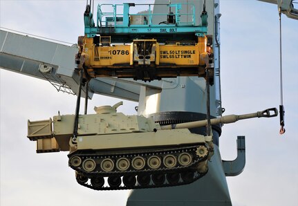 A M109A6 Paladin howitzer assigned to Bravo Battery, 1st Battalion, 214th Field Artillery Regiment, 648th Maneuver Enhancement Brigade, Georgia Army National Guard, is lifted onto a cargo ship May 10, 2021, in Jacksonville, Florida. The Georgia Army National Guard’s participation in exercise African Lion 21 allowed the organization to train on railhead and port operations.