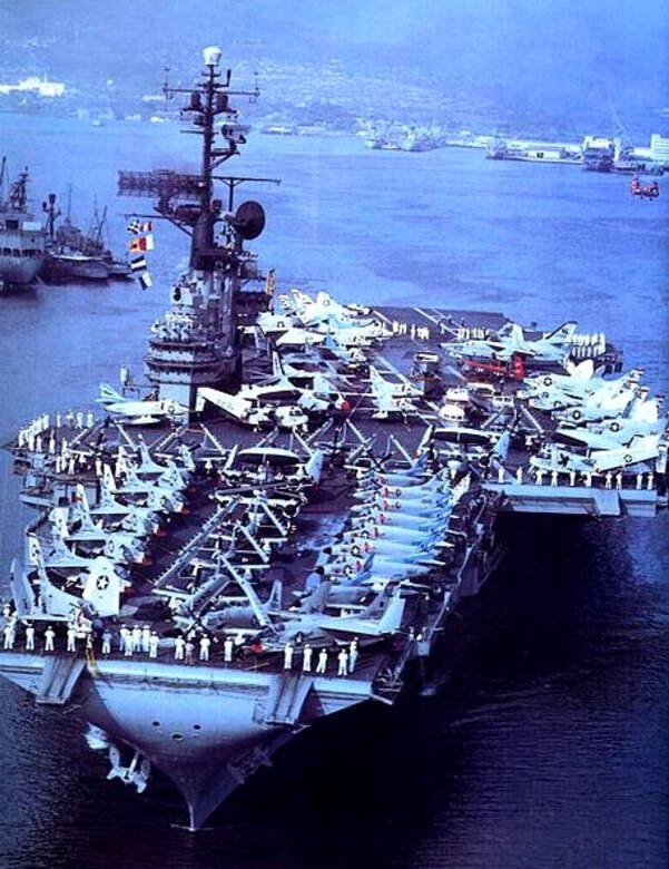 Aircraft carrier sails sea.