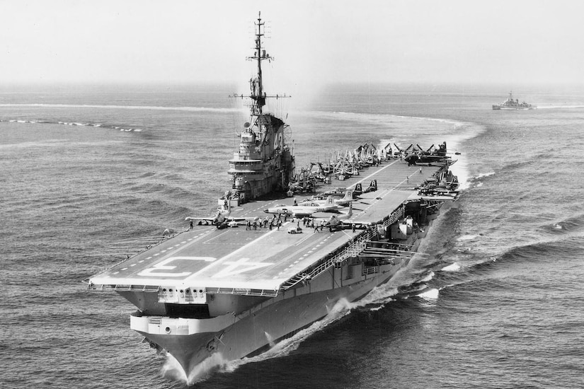 Aircraft carrier sails sea.