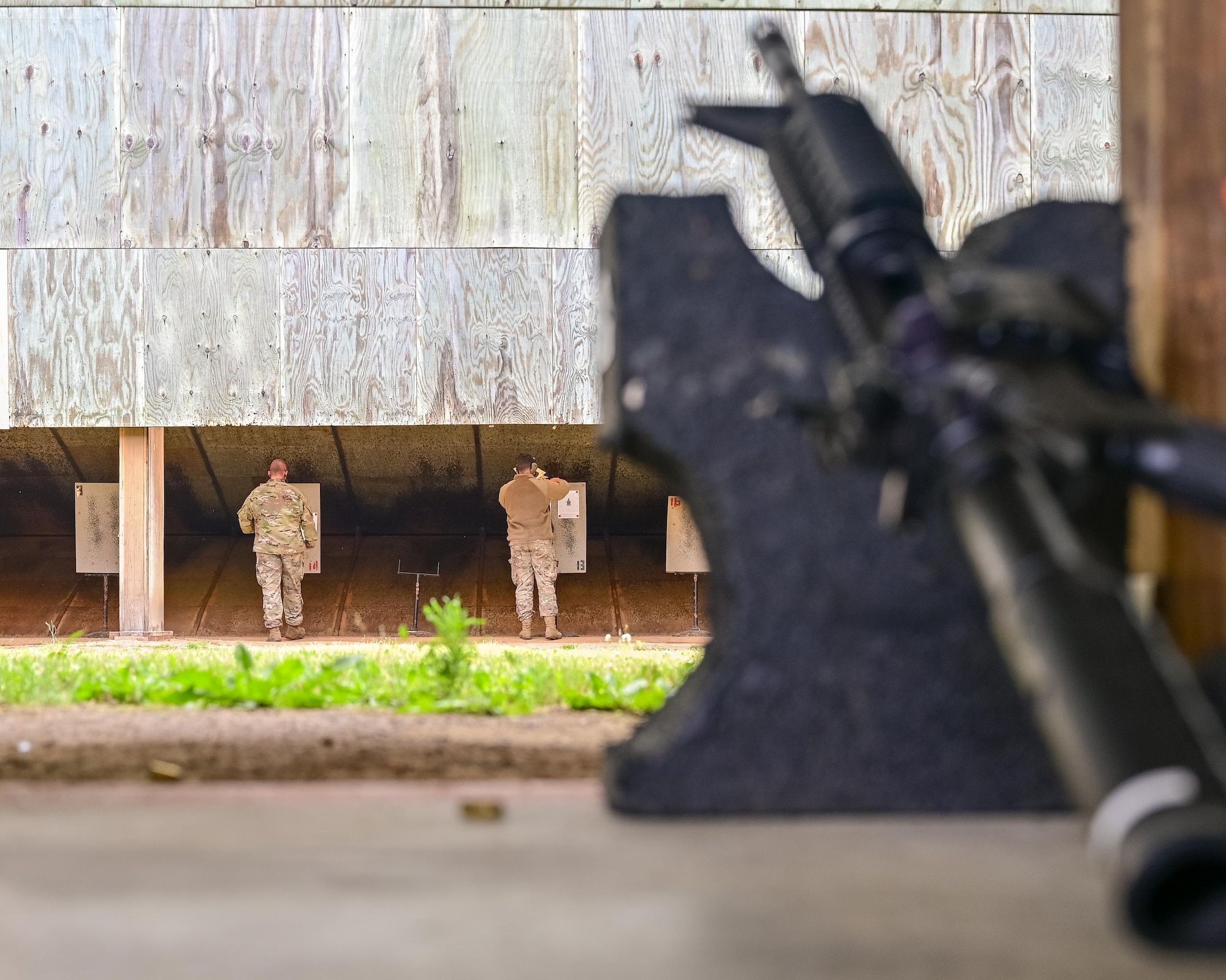 Airmen place their targets during a shooting competition