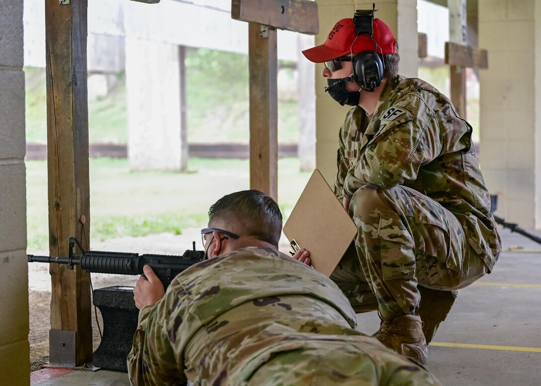 An Airman fires his M-4 rifle during a shooting competition