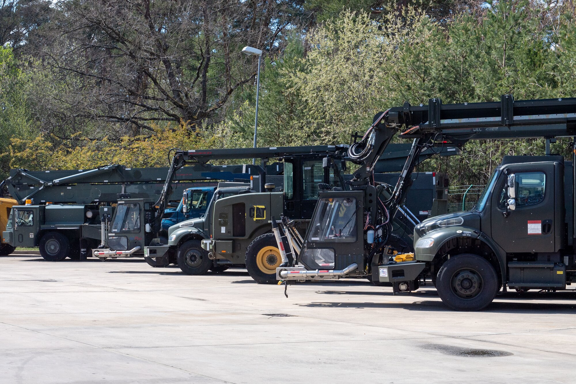 Vehicles sit in a compound at Ramstein Air Base, Germany
