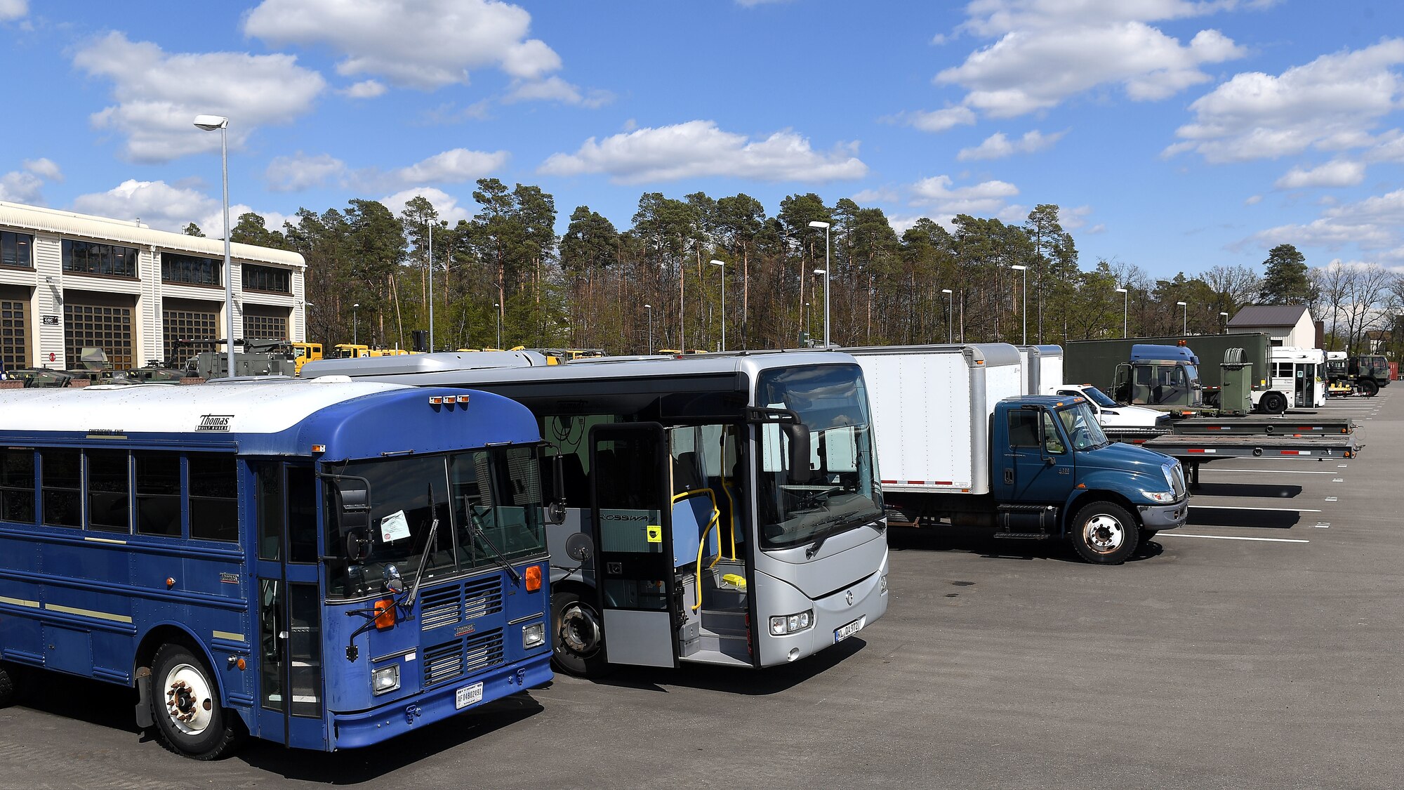 Vehicles sit in a compound at Ramstein Air Base, Germany