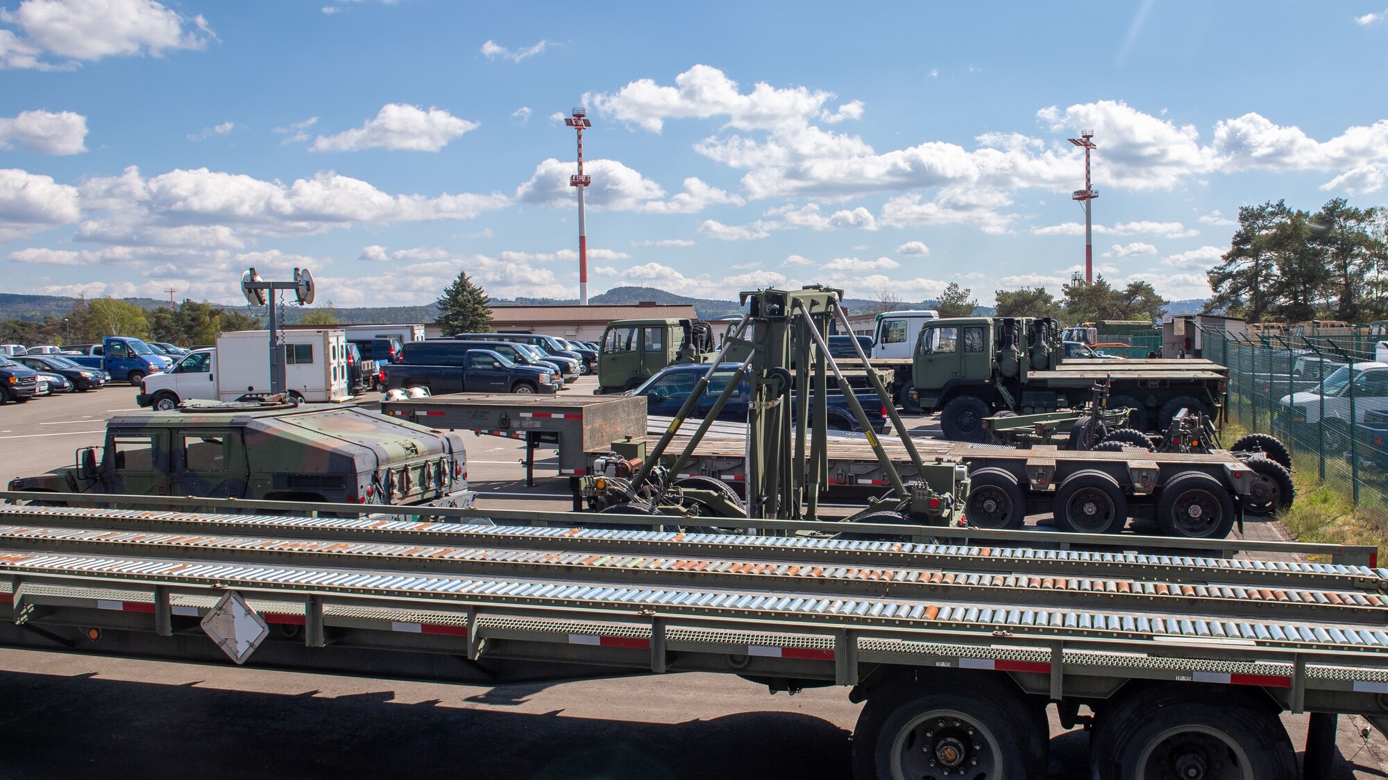 Vehicles sit in a compound at Ramstein Air Base, Germany